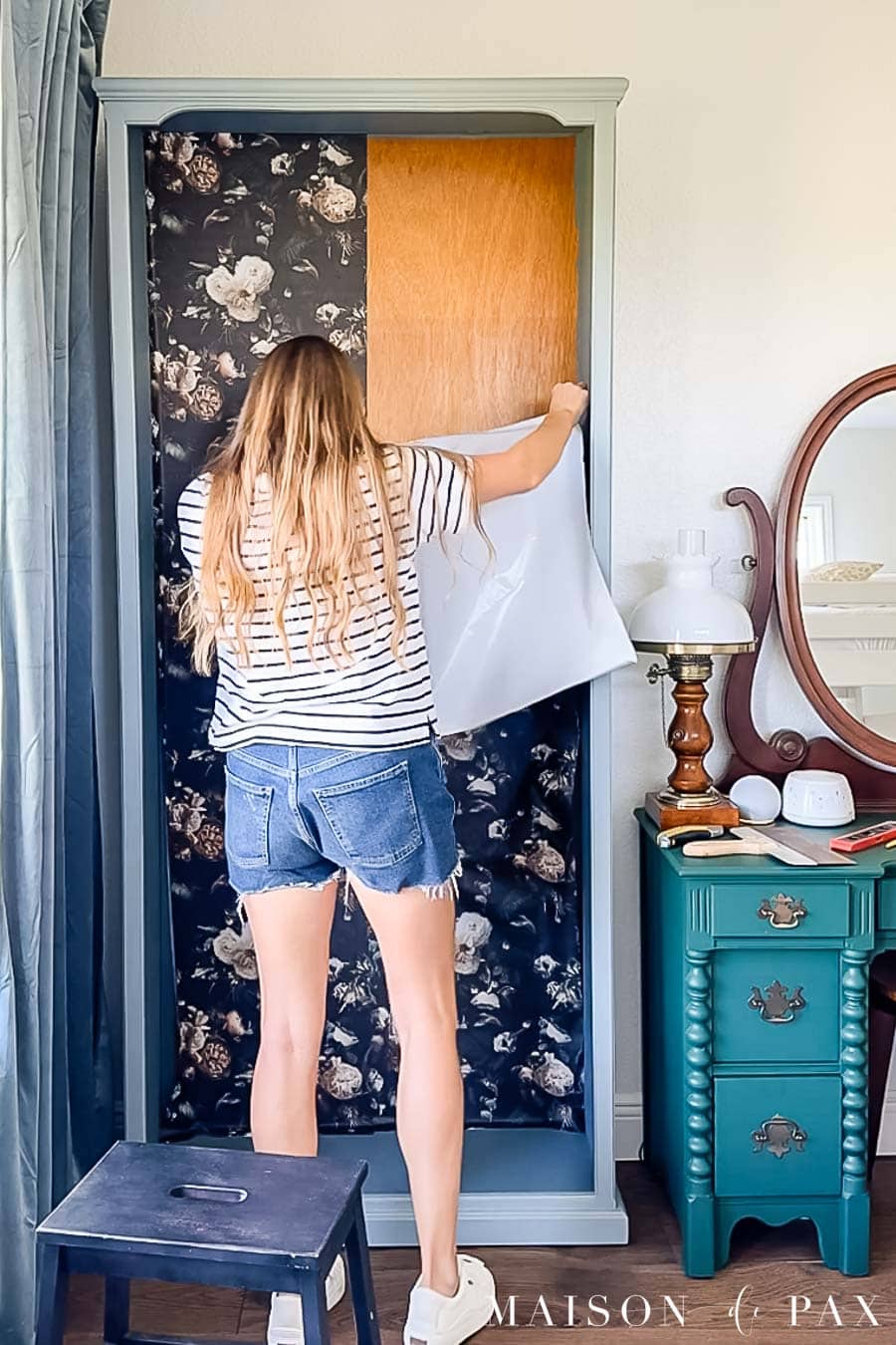installing peel and stick wallpaper to back of bookcase