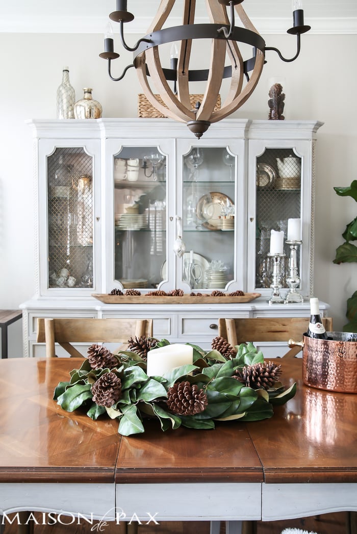 simple greenery and mercury glass makes this French farmhouse style dining room all set for Christmas!
