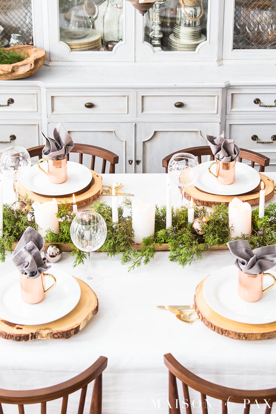 white tablecloth on a dining table with modern farmhouse style decorations