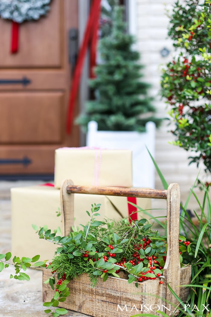 Greenery and Red Holiday Front Porch: What a beautiful, classic look! Get Christmas front porch decorating ideas here!