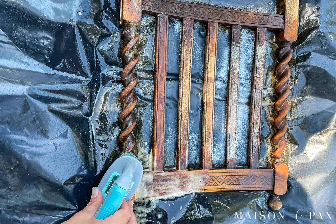scrubbing wood with soap and water to remove old varnish