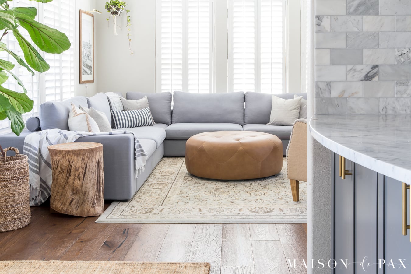 Bright living room design with sectional- Maison de Pax