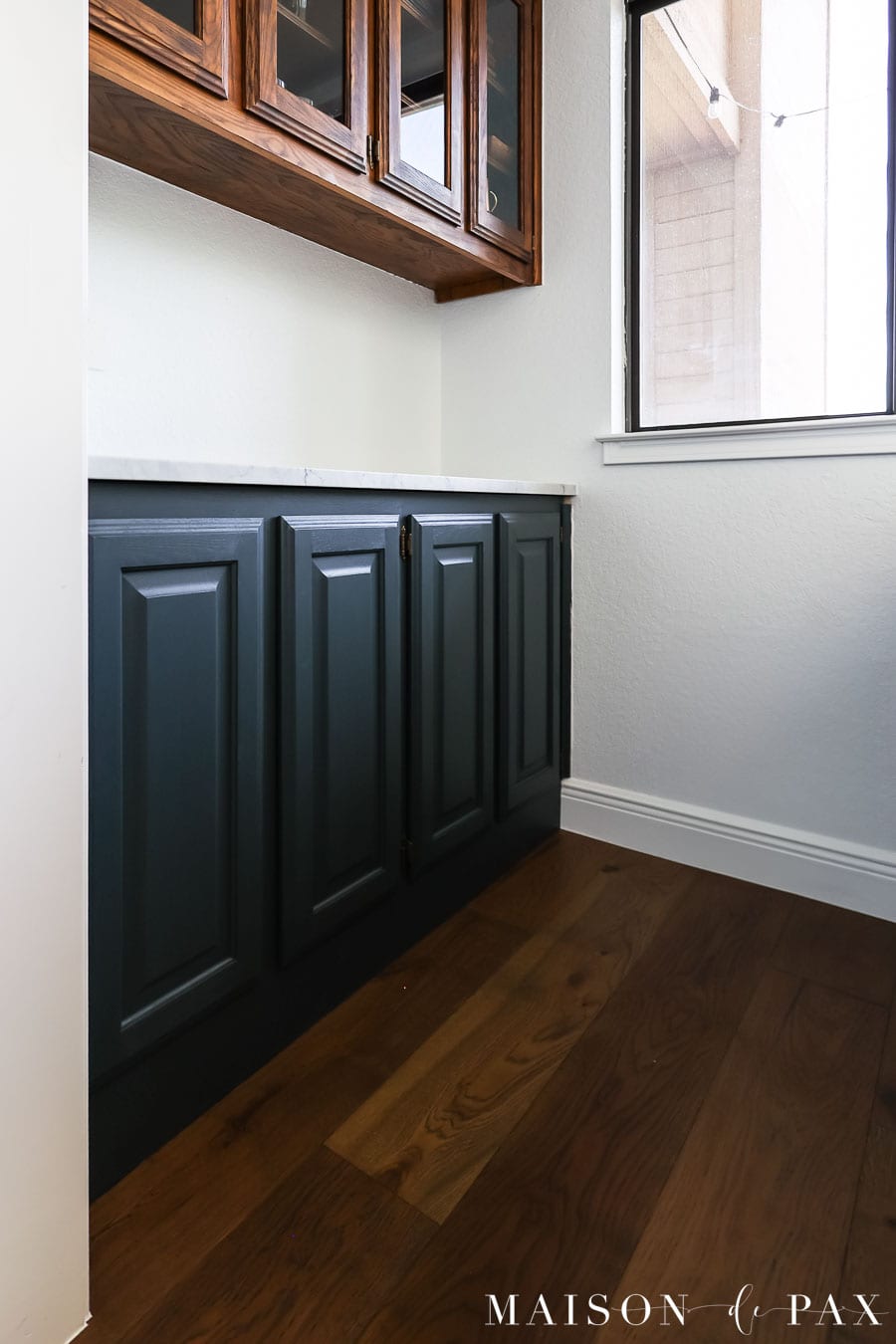painted dark blue lower cabinets with stained upper cabinets