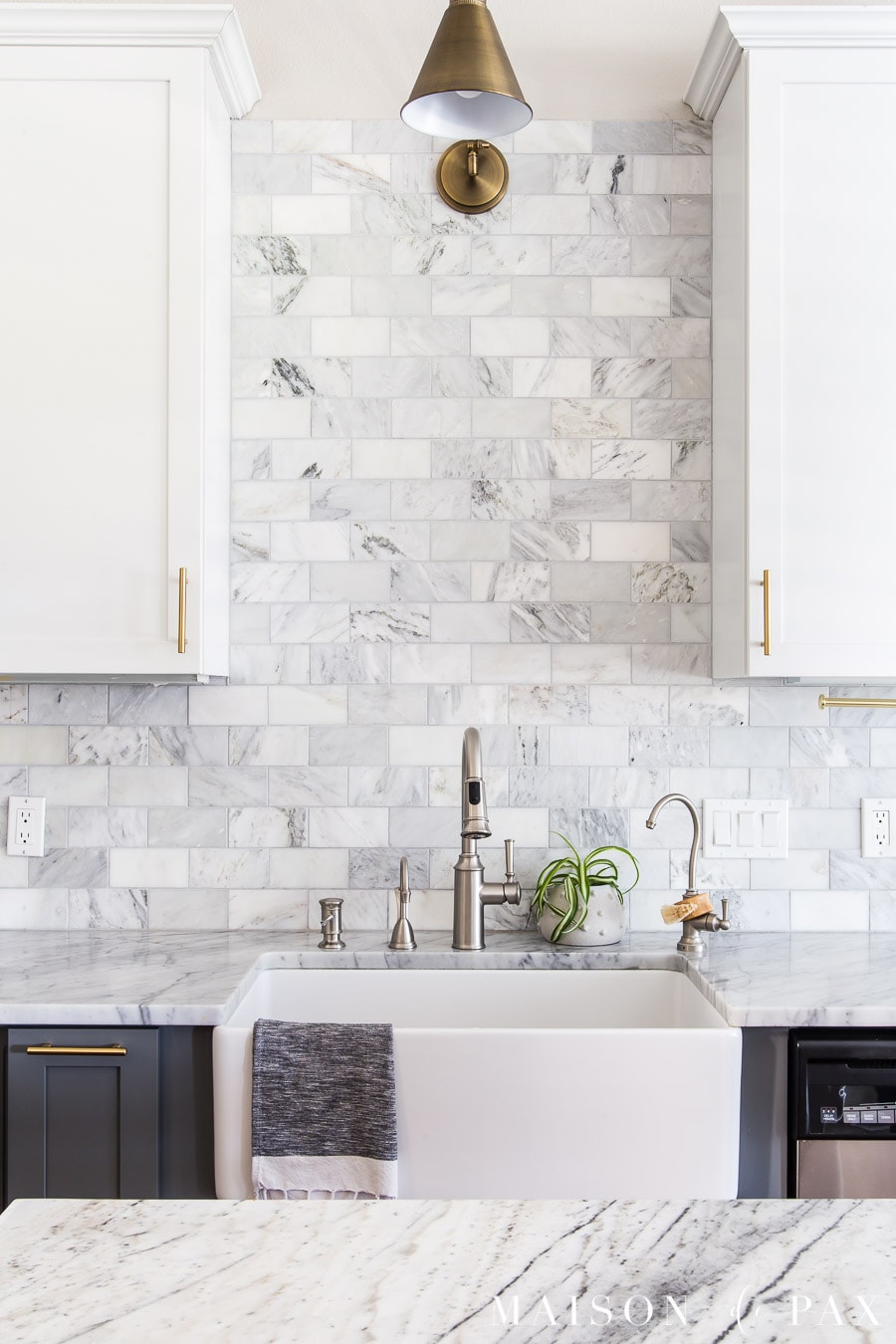 kitchen farmhouse sink with marble counters and honed marble backsplash | Maison de Pax