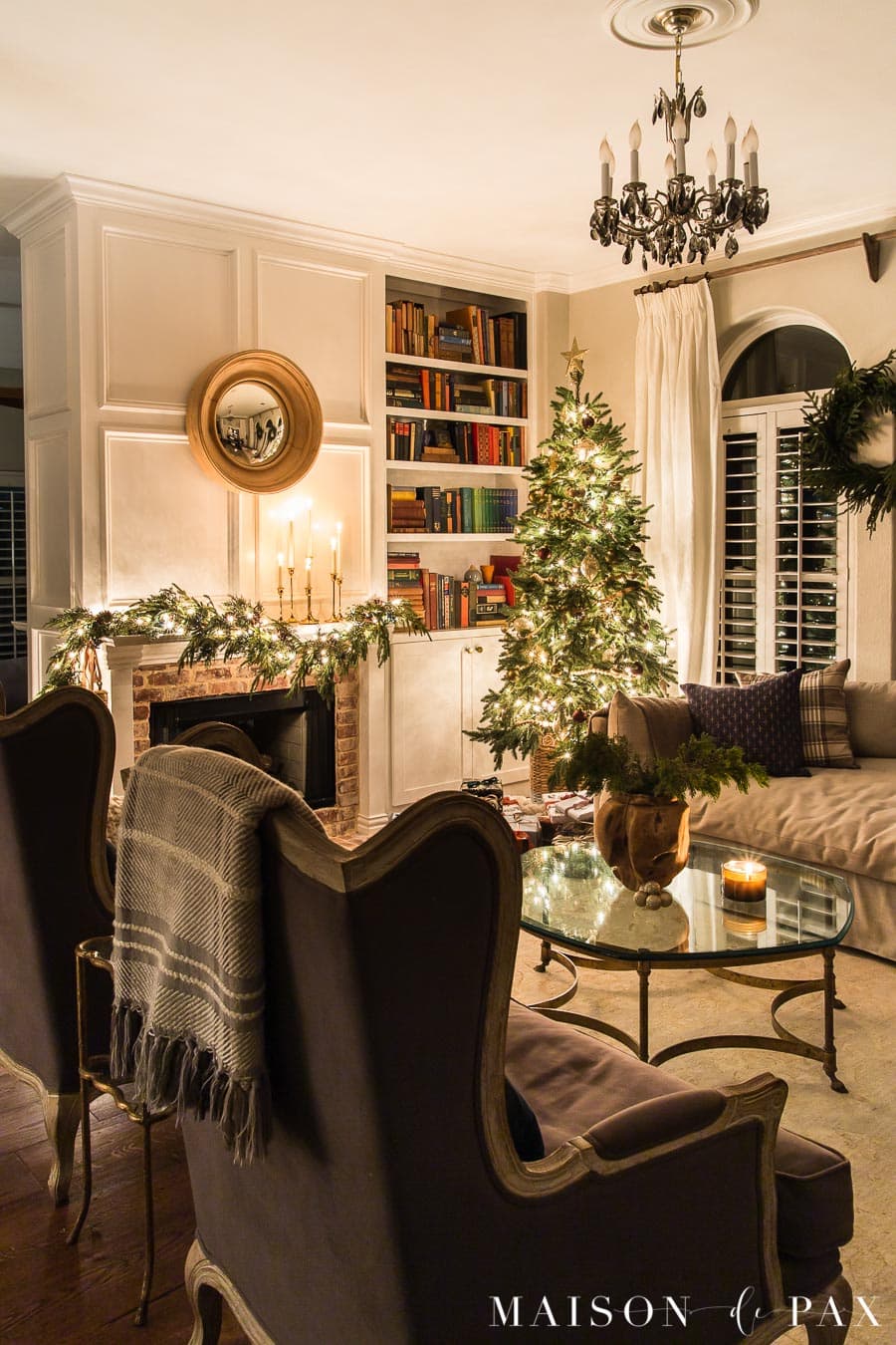 living room lit by candlelight at Christmas time