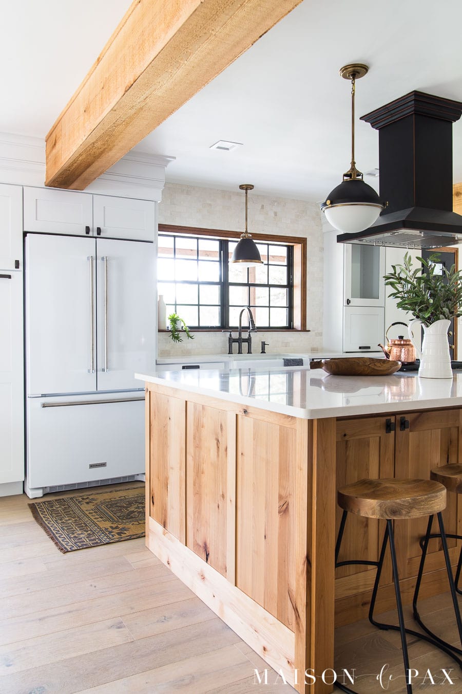 white fridge, rustic beams, wood island in kitchen | Maison de Pax