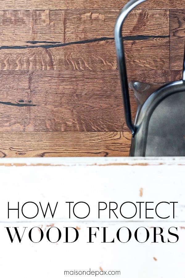 wide plank medium brown wood floors and metal chair with overlay: how to protect wood floors | Maison de Pax