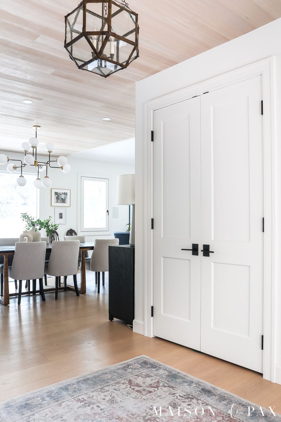 entryway with sw pure white walls, trim, and doors