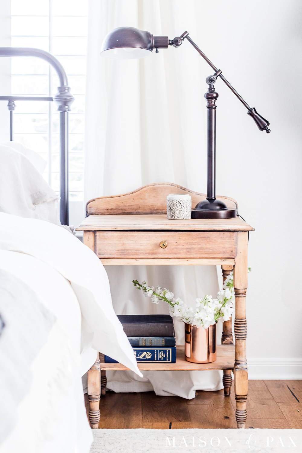 tip #5: add cut flowers in unexpected places... Looking to add a seasonal touch to your bedroom?  Don't miss these incredibly simple master bedroom decorating ideas for spring! #springdecor #springbedroom #nightstand #modernfarmhouse