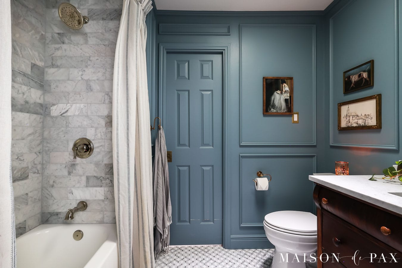 blue bathroom with marble and linen pinch pleat shower curtains