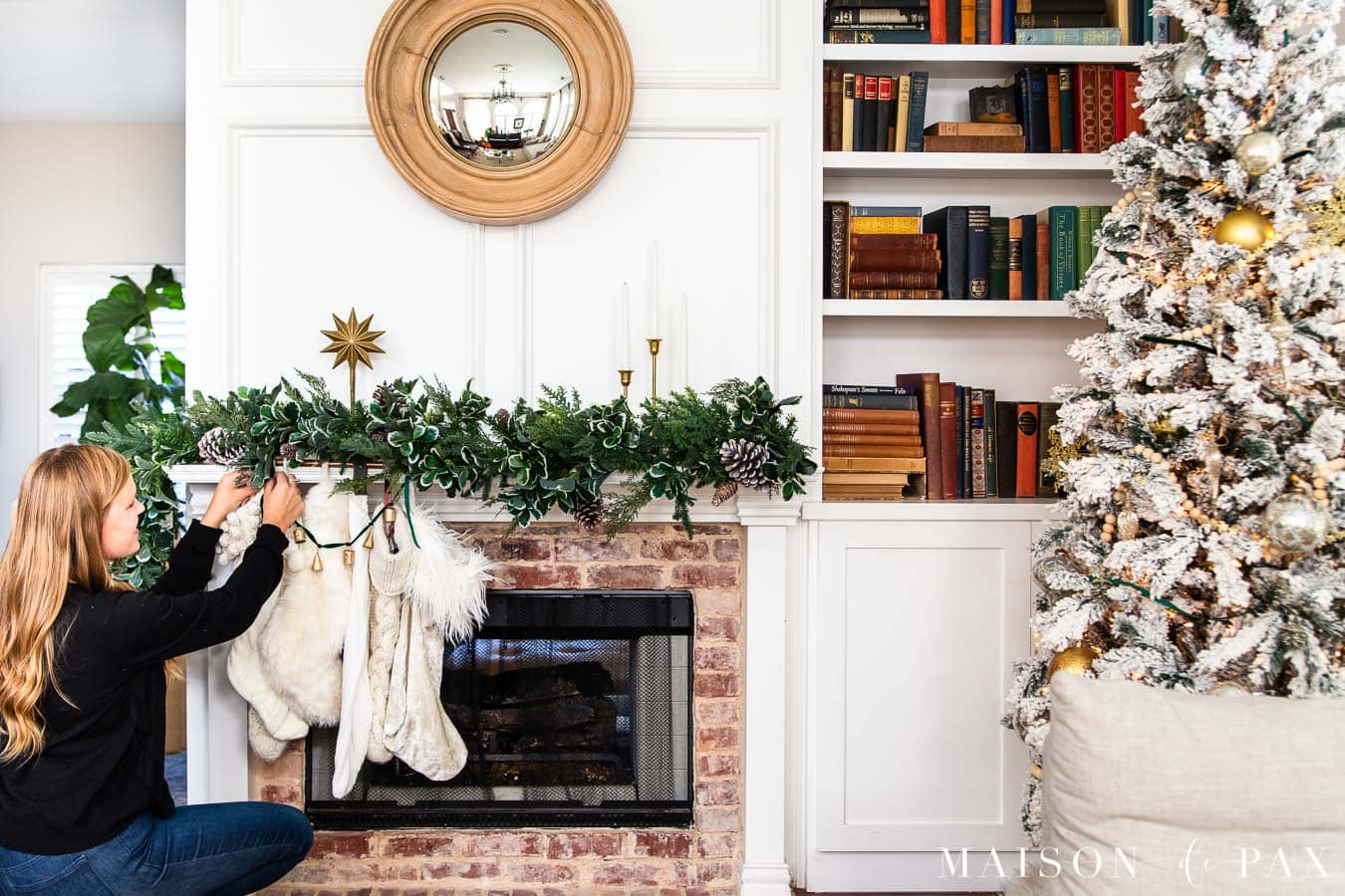 white mantel with asymmetrical green garland | Maison de Pax