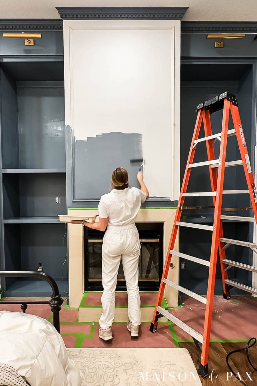 painting fireplace and bookcases dark, moody blue
