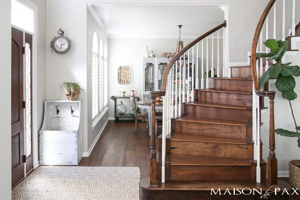 Cascading wood stairs and view of modern farmhouse dining room - Maison de Pax