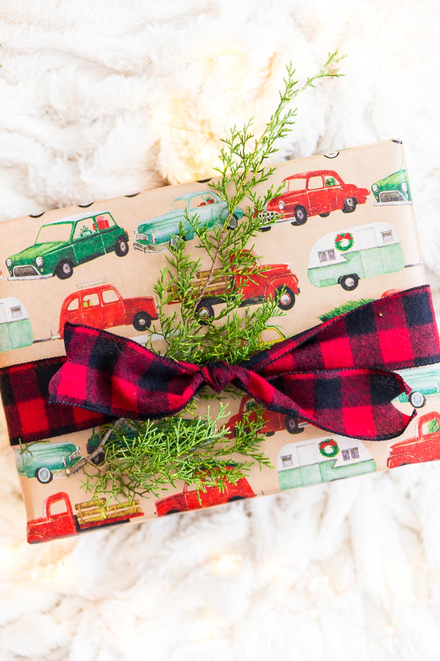 christmas present with cedar clipping and red plaid ribbon | Maison de Pax