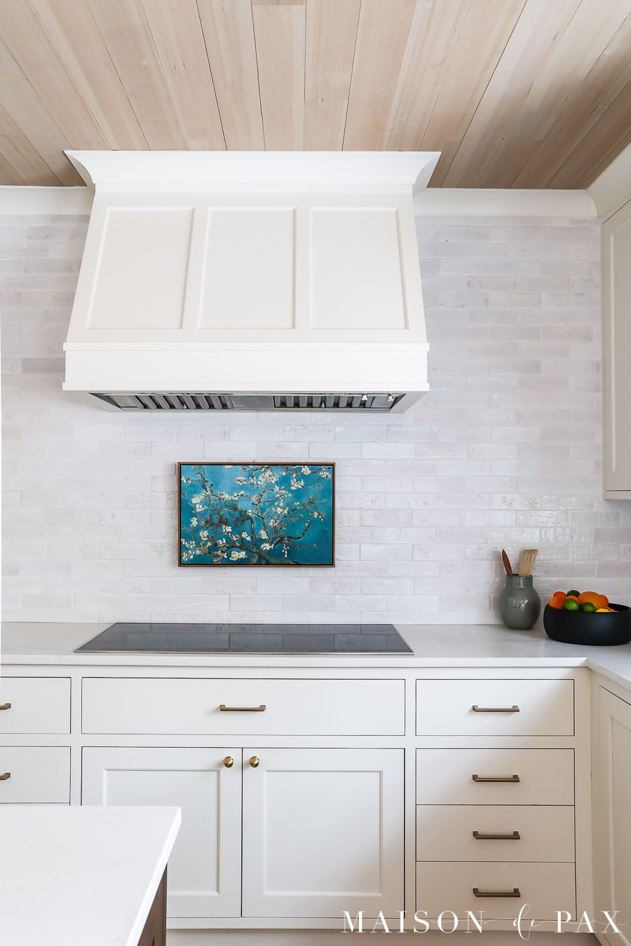 white kitchen cabinets with satin brass hardware knobs and pulls