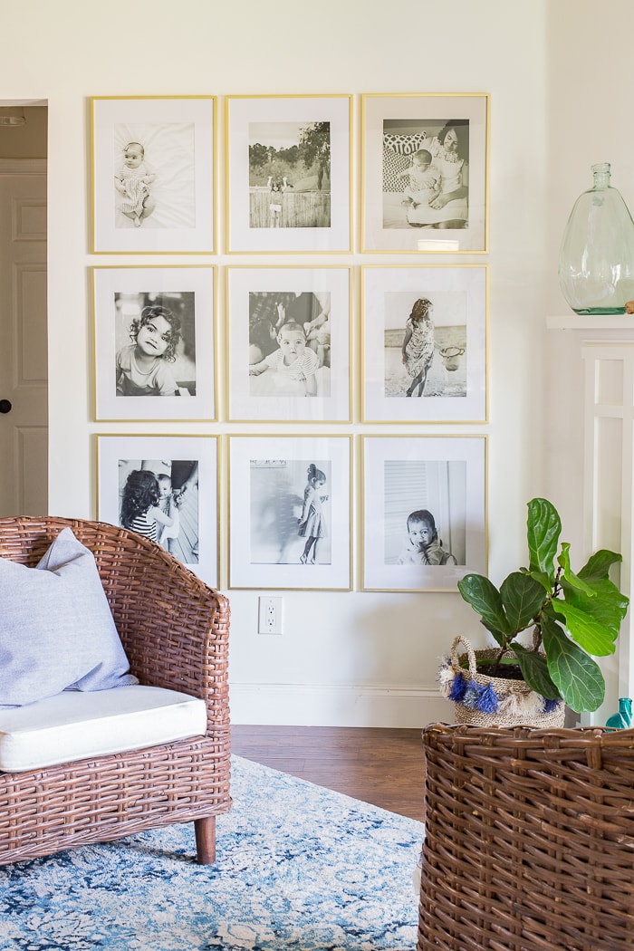 What a fun beachy vibe in this coastal living room! Blues, greens, weathered wood, and DIY wall art make it a beautiful, comfortable space.