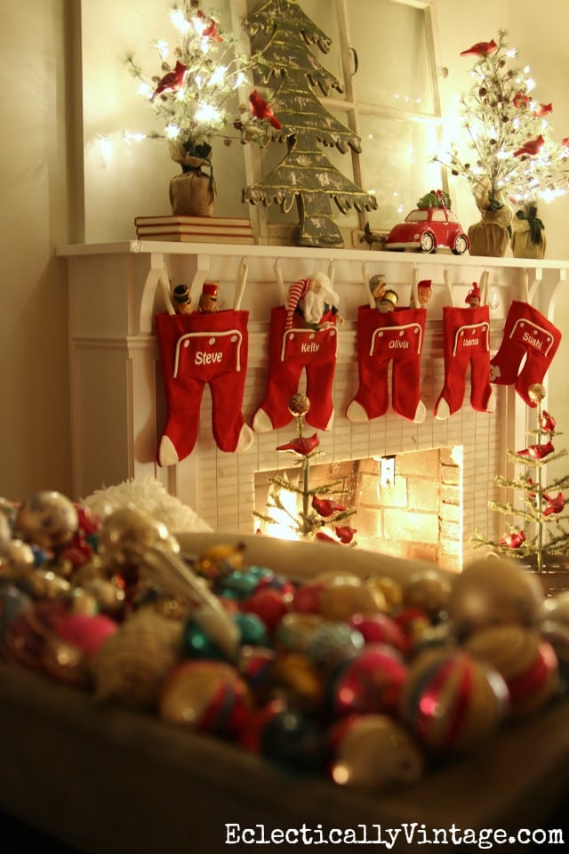what a fun and festive fireplace all lit up for Christmas!