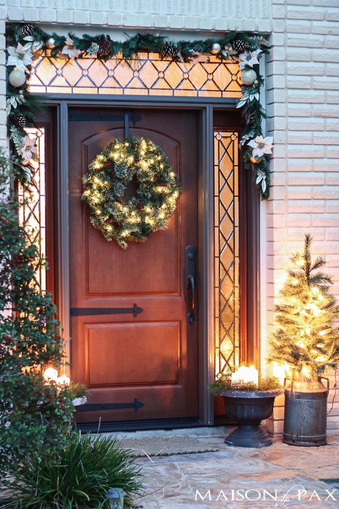 I love this simple, white and green look for the holidays! Classic greenery and white accents for a Christmas Front Porch | aiweb9ygdry.cmersite.com