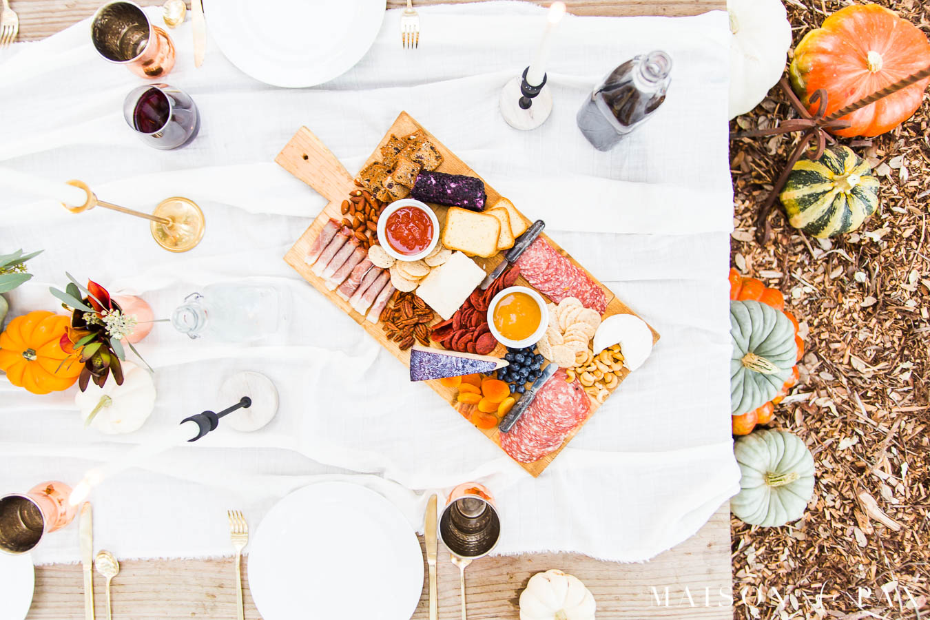 charcuterie board with reds, purples, and oranges for a Thanksgiving table | Maison de Pax