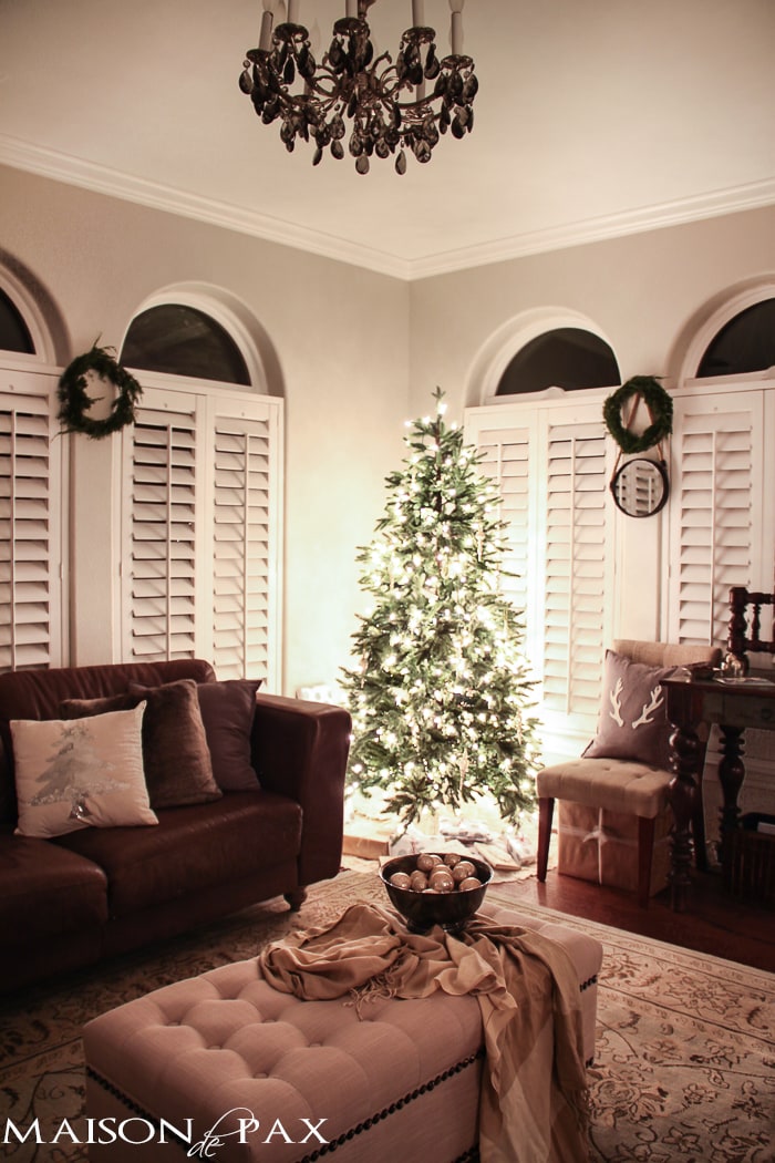 holiday decorating: christmas tree with white lights and mercury glass, antler pillow, wreath, sequin tree pillow