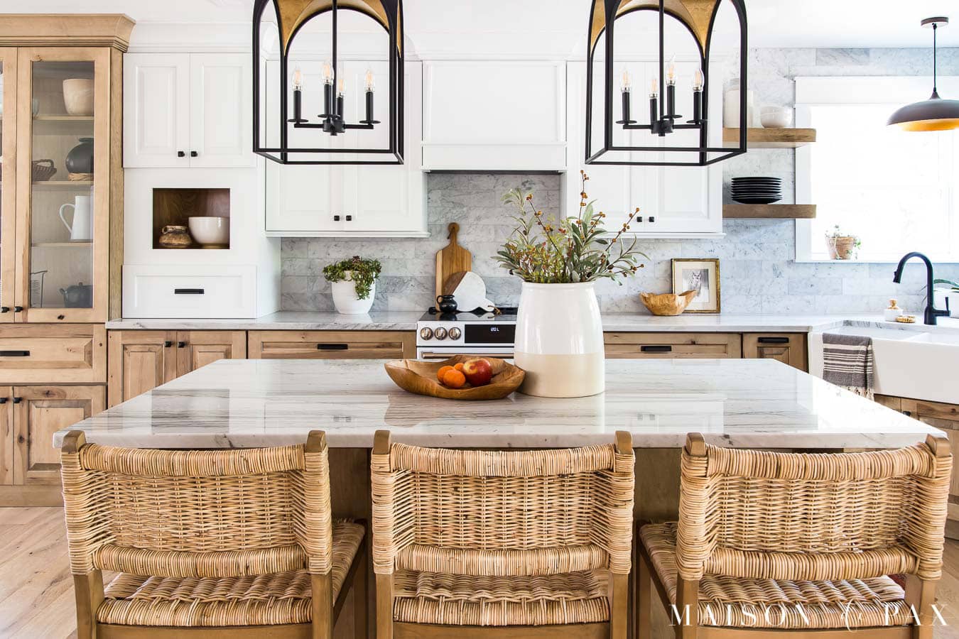 white and wood kitchen cabinets with quartzite counters