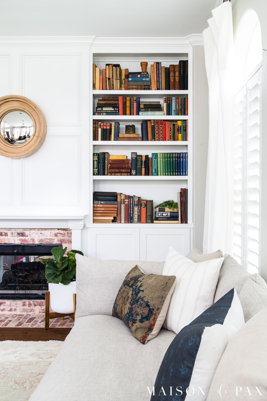classic white mantel with floor to ceiling built ins