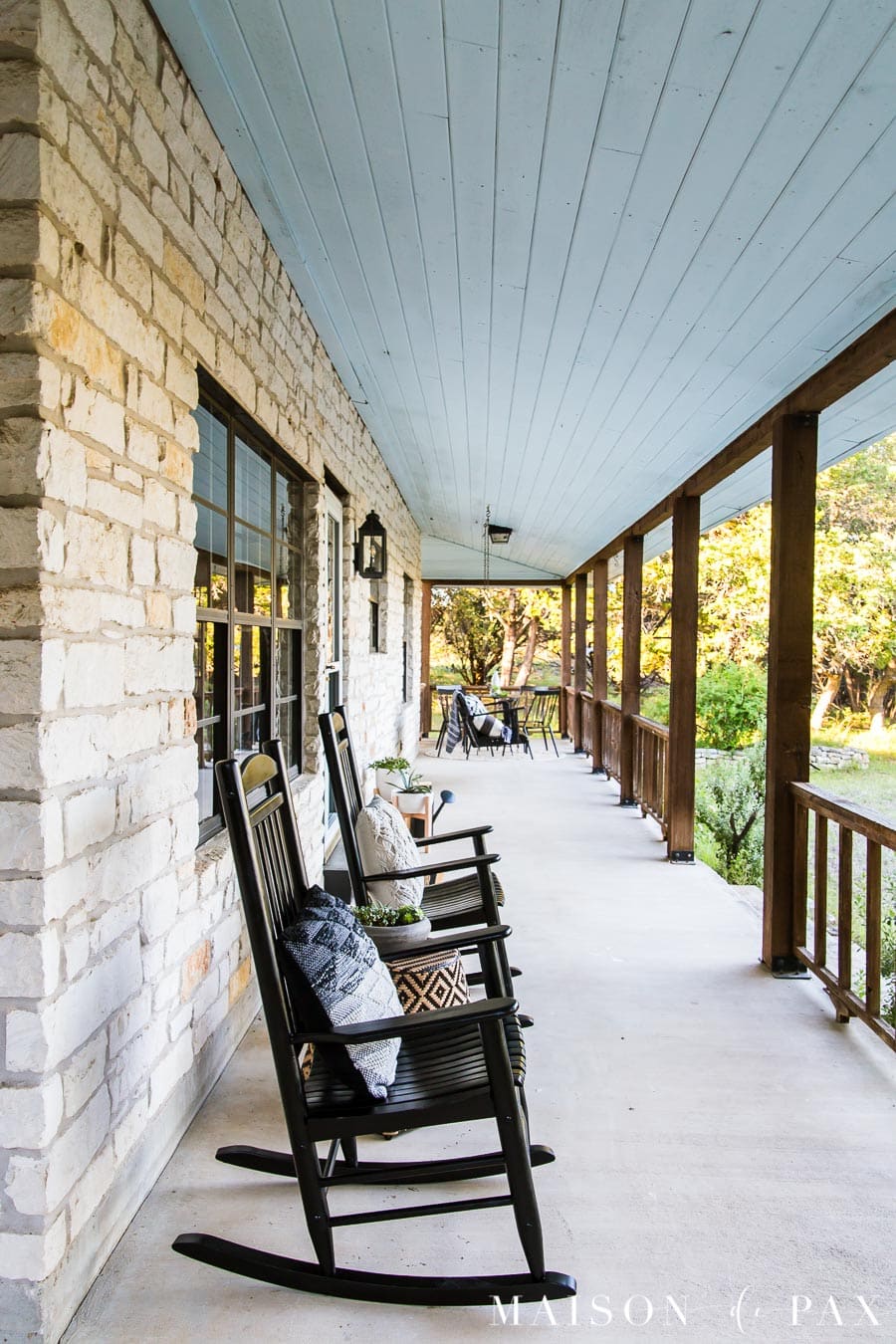 two black rocking chairs on big ranch front porch | Maison de Pax