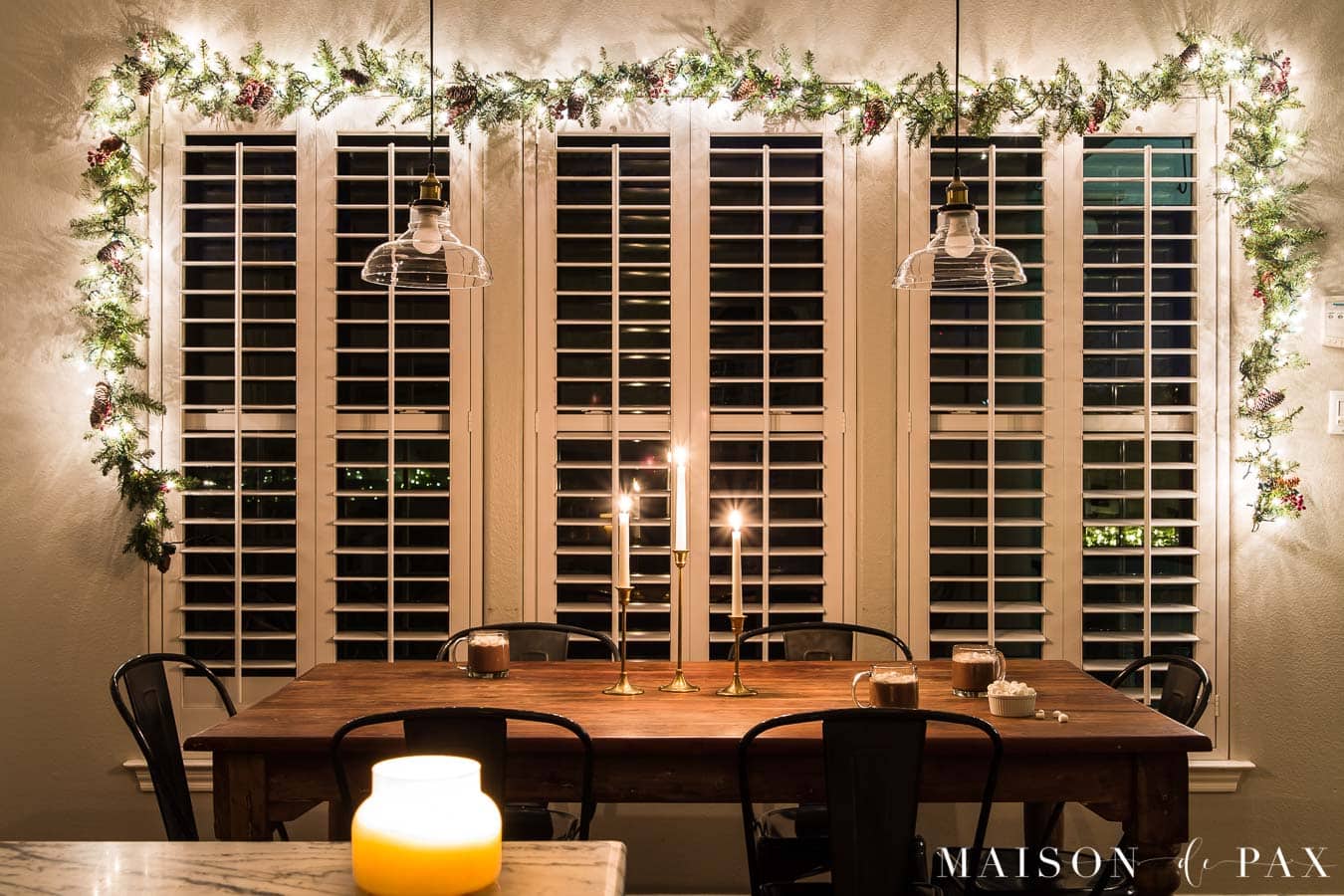 large windows with garland with lights | Maison de Pax