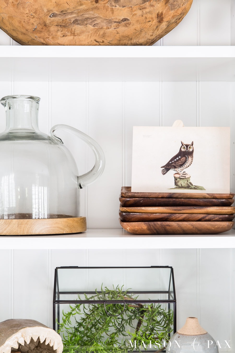 wood tones and vintage art on style shelves | Maison de Pax