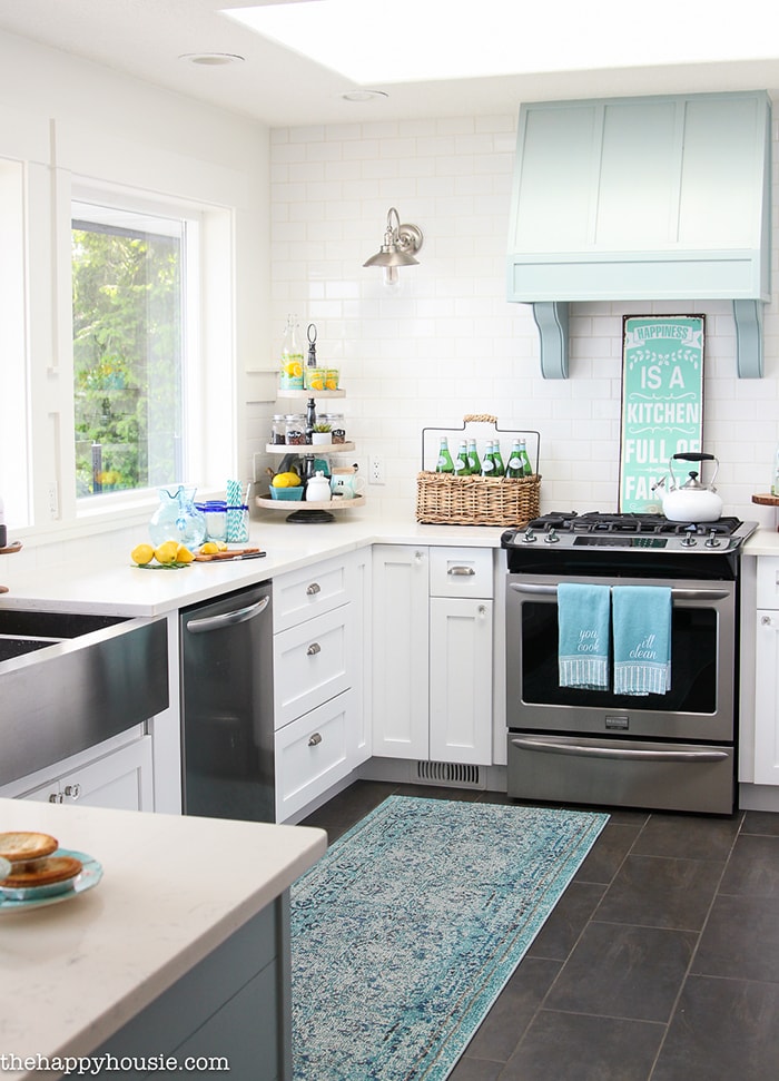 A Happy Kitchen: such a gorgeous aqua and white kitchen with beautiful, white counters and many diy elements
