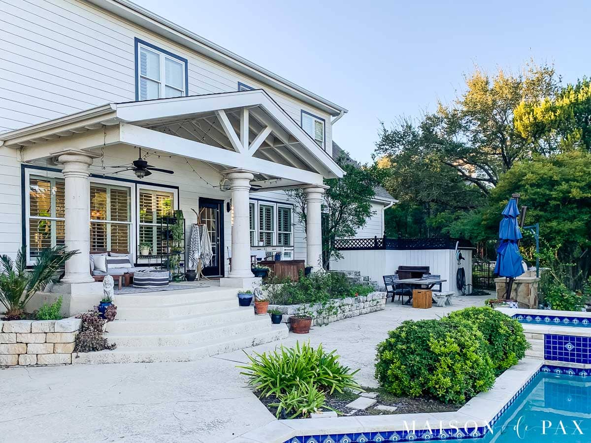 white duck exterior with tricorn black trim and blue pool | Maison de Pax