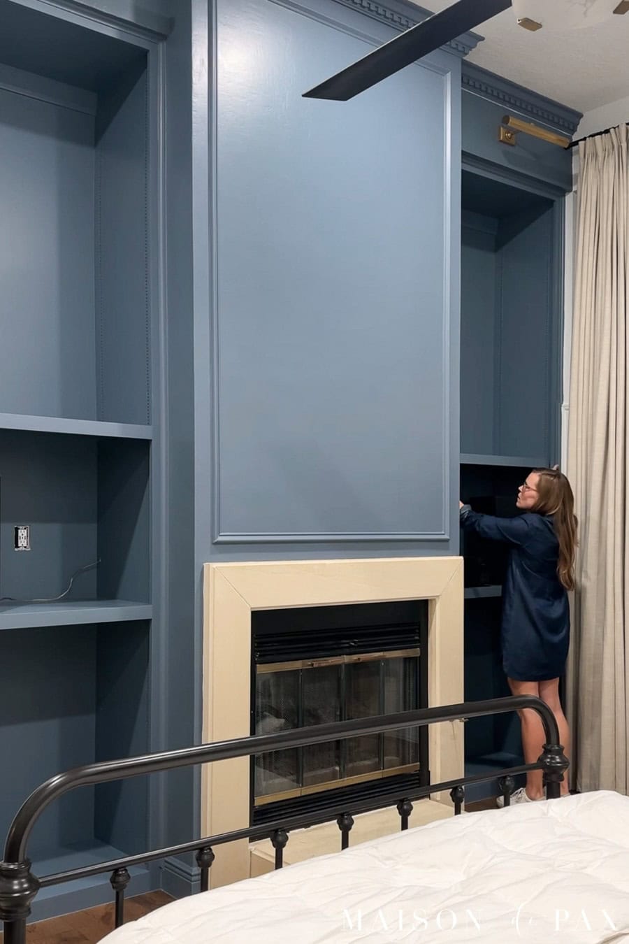 adding a fixed shelf to bookcases on either side of fireplace