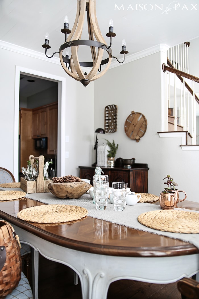 wine barrel chandelier provides a casual yet elegant look in this french country dining room | aiweb9ygdry.cmersite.com