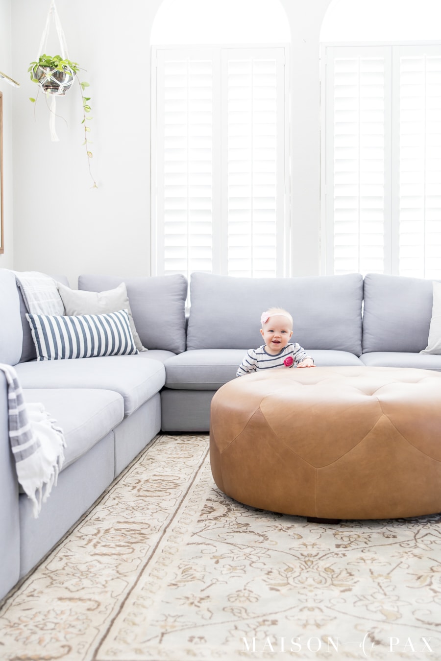 Bright living room design with sectional- Maison de Pax