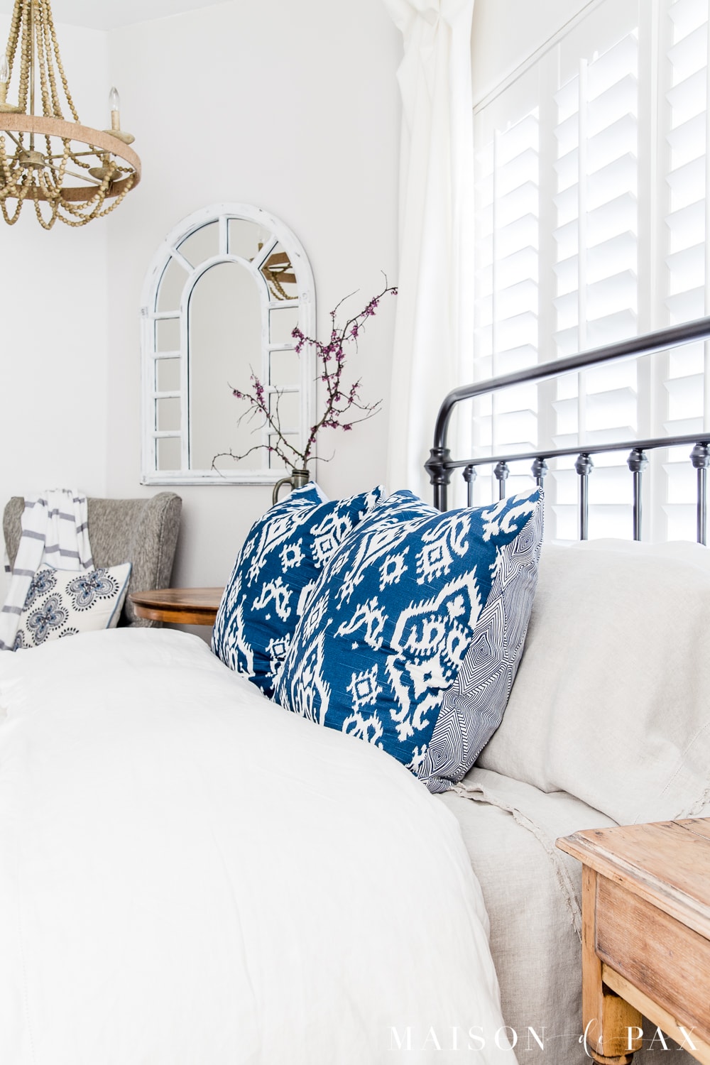 tip #3: accent with colorful pillows... Looking to add a seasonal touch to your bedroom?  Don't miss these incredibly simple master bedroom decorating ideas for spring! #springdecor #springbedroom #nightstand #modernfarmhouse