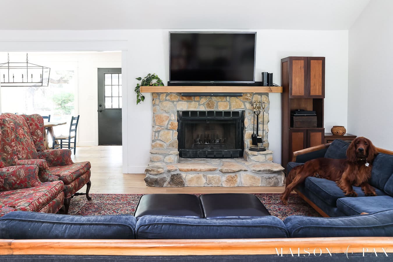 living room with blue velvet sofa