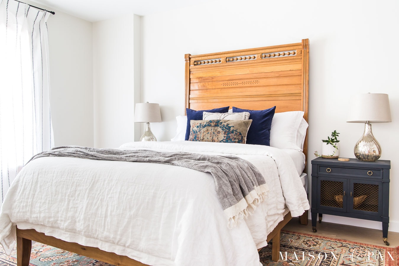 antique full sized headboard on queen sized platform bed | Maison de Pax