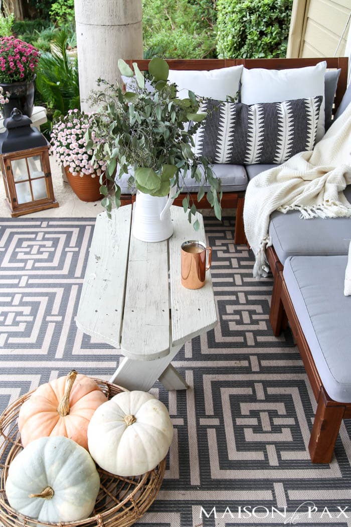 pastel pumpkins in a basket on the porch for fall- Maison de Pax