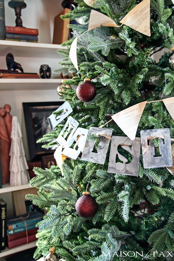 Love this simple Christmas tree decorating idea! Book page bunting and ornaments with stenciled words... Simple and beautiful! via aiweb9ygdry.cmersite.com