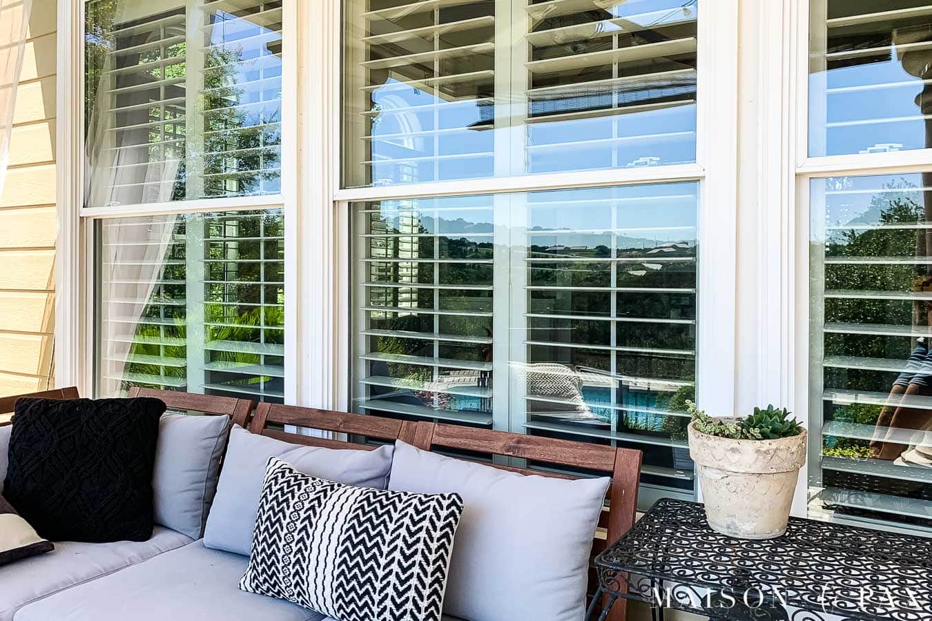 clean patio windows behind outdoor sofa on back porch | Maison de Pax