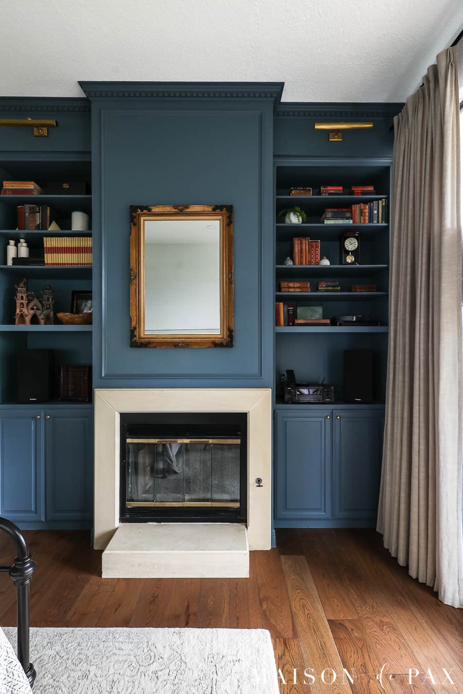 styling bookcases with antique books, art, clocks, vases, and more