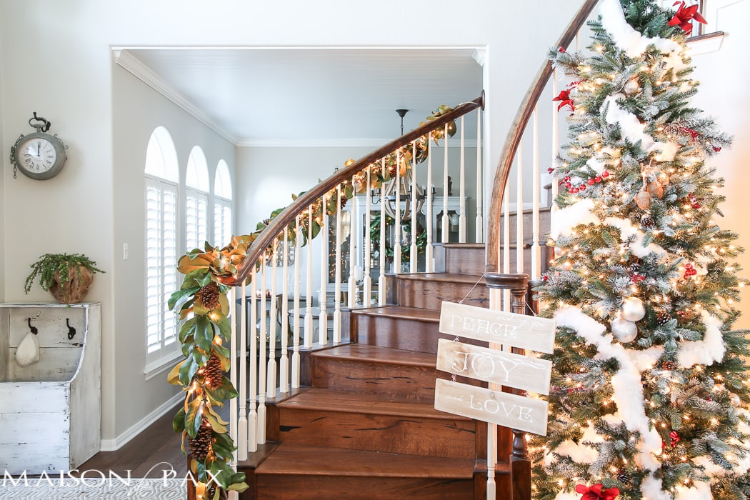 simple greenery and mercury glass makes this French farmhouse style dining room all set for Christmas!
