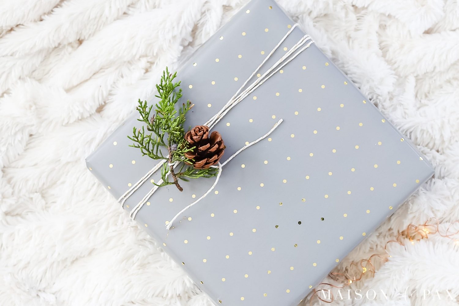 easy gift wrapping ideas: add sprigs of greenery and pinecones to your gifts #christmaspresents #giftwrap