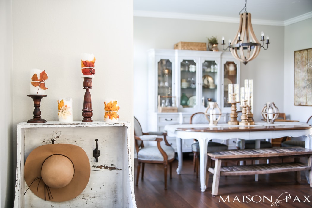 leaf wrapped candles give a slight nod to fall in this neutral home- Maison de Pax