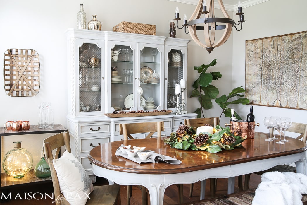 simple greenery and mercury glass makes this French farmhouse style dining room all set for Christmas!