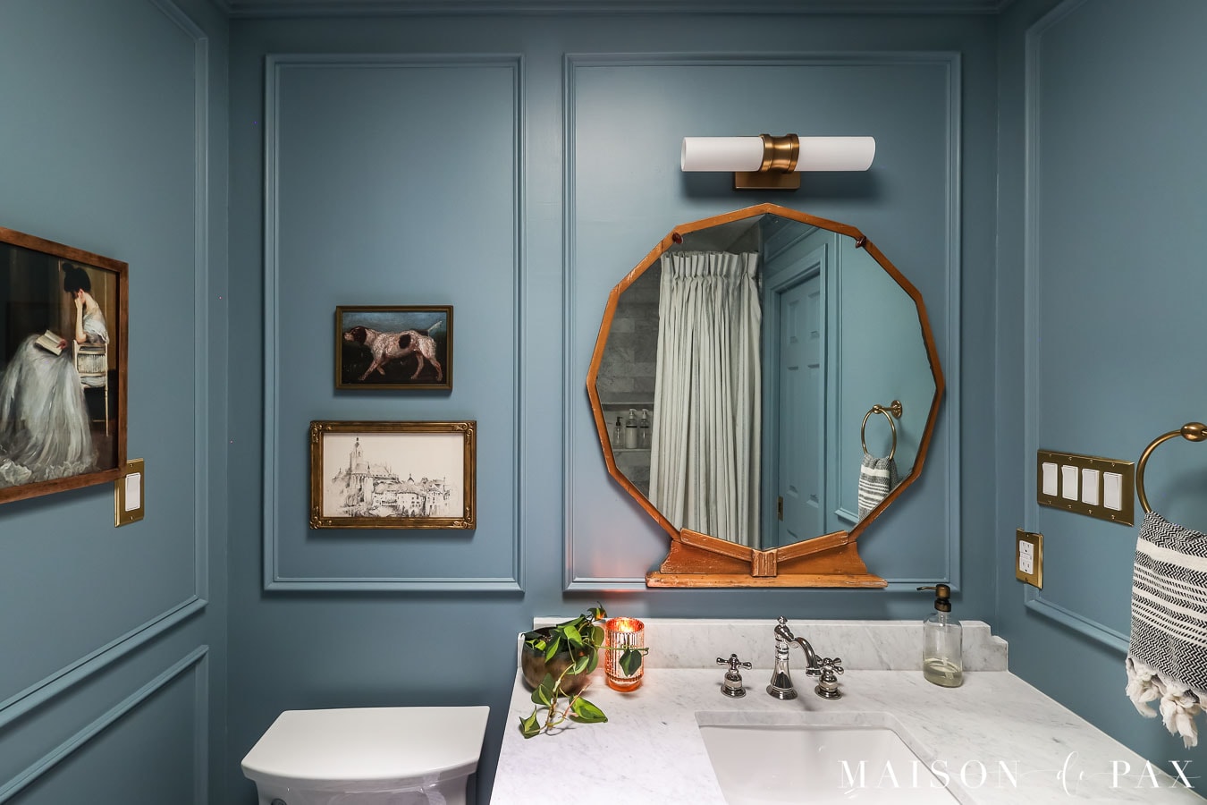 vintage decor in an elegant blue bathroom
