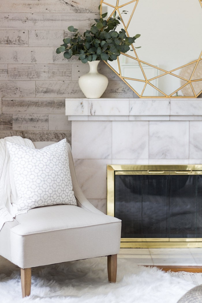 Marble fireplace and whitewashed wall- Maison de Pax