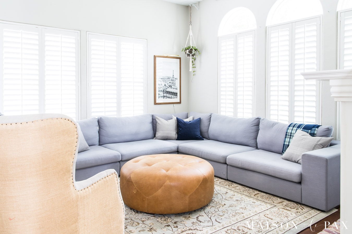 brown leather ottoman with blue gray sectional | Maison de Pax