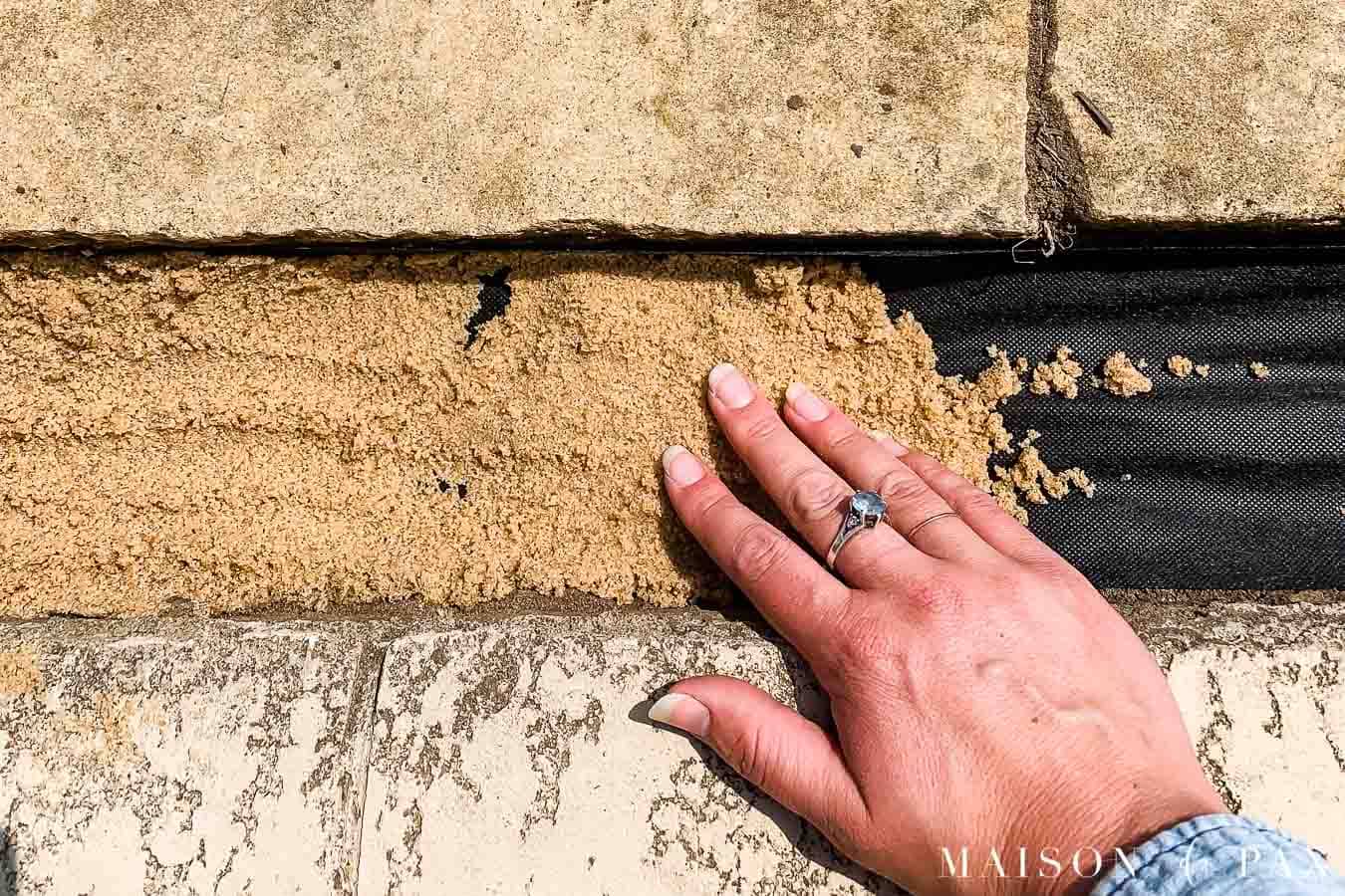 laying sand under synthetic turf