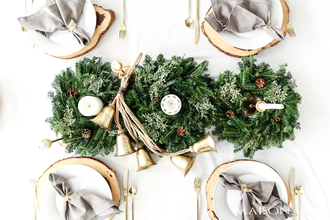 use three mini wreaths to create a gorgeous natural centerpiece of greenery for your holiday tablescape - Maison de Pax 
